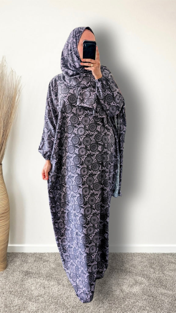 Purple Mandala print prayer abaya with matching hijab on plain studio background