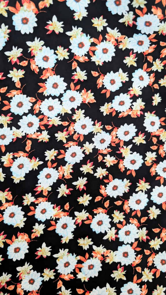 Floral pattern with white flowers on a black background
