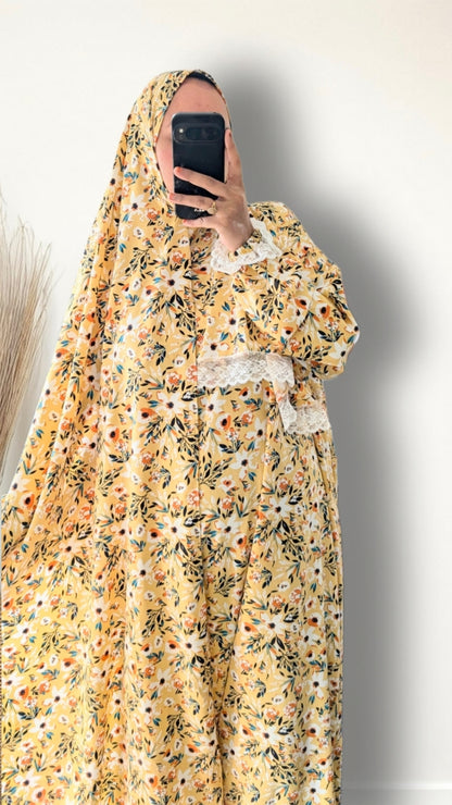 Yellow honey meadow floral print prayer abaya with matching hijab on plain studio background
