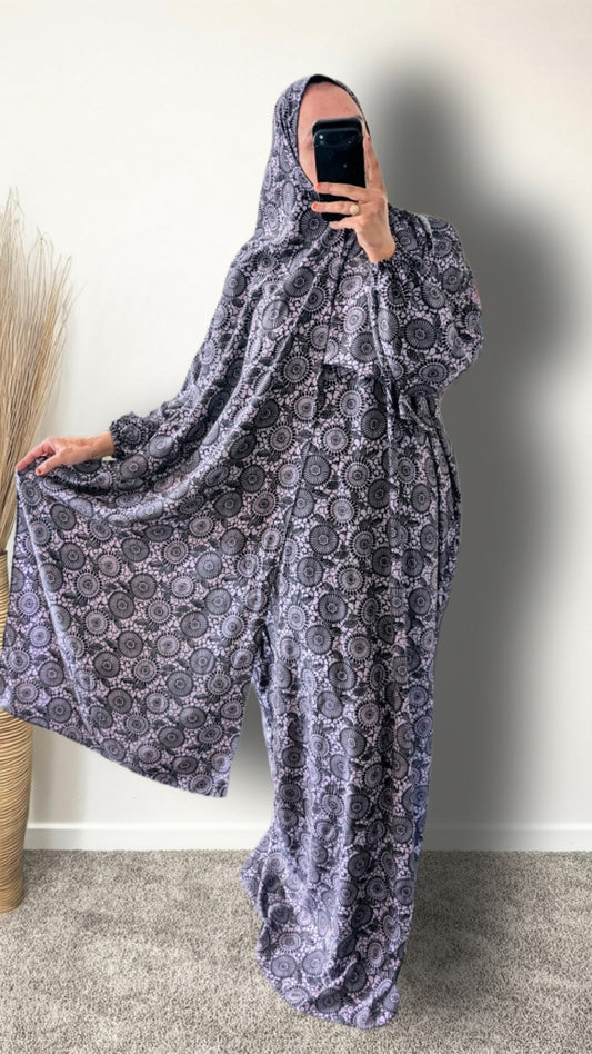 Purple Mandala print prayer abaya with matching hijab on plain studio background
