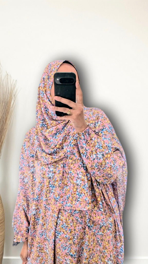 Muslim women wearing Rose Pink ditsy floral print prayer abaya with matching hijab on plain studio background