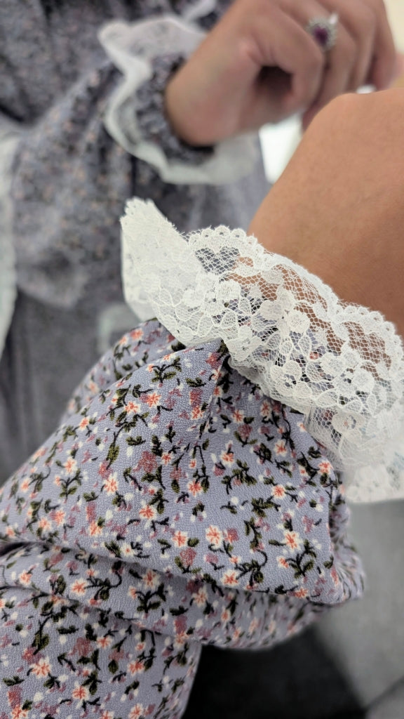 Close-up of a floral-patterned garment with lace trim