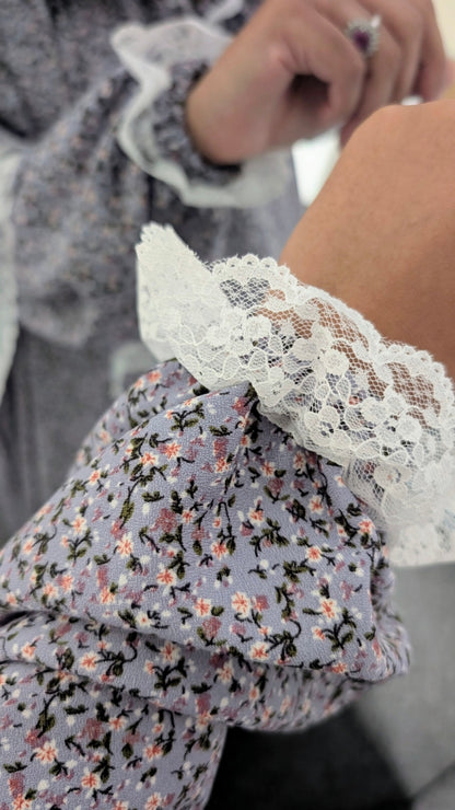 Close-up of a floral-patterned garment with lace trim
